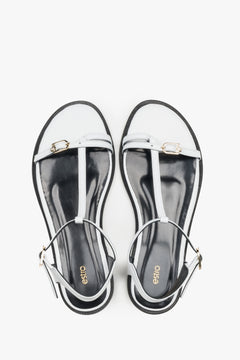 Top view of women's white leather flat sandals with gold details by Estro