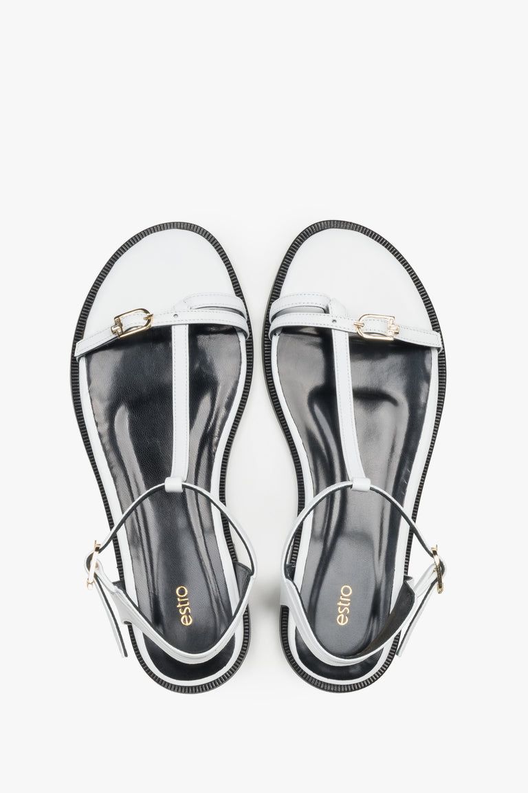 Top view of women's white leather flat sandals with gold details by Estro