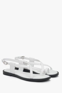 Women’s white leather flat sandals with a toe loop, Estro.