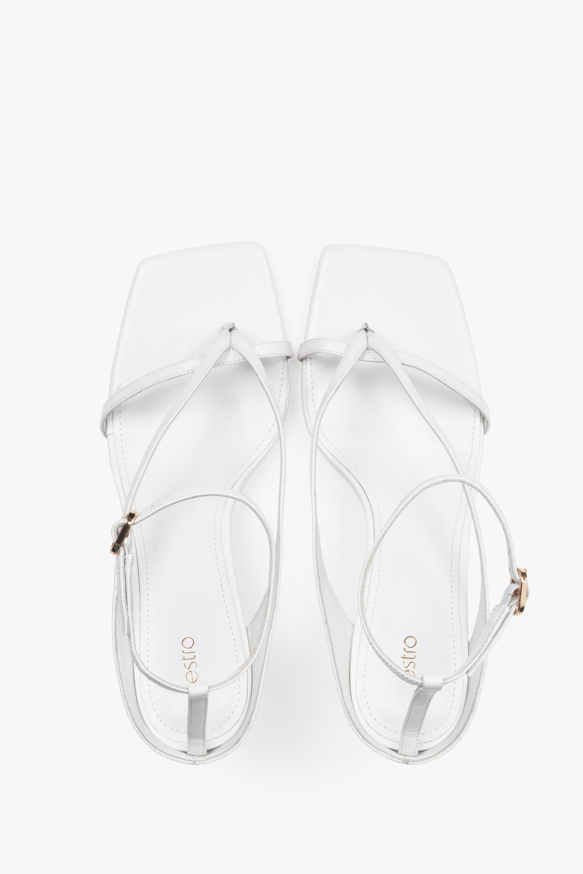 Elegant white sandals with thin straps, made of genuine leather, 7.5 cm heel – top view.