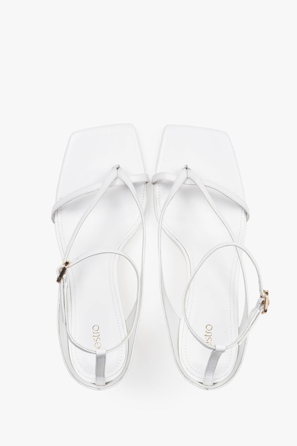 Elegant white sandals with thin straps, made of genuine leather, 7.5 cm heel – top view.