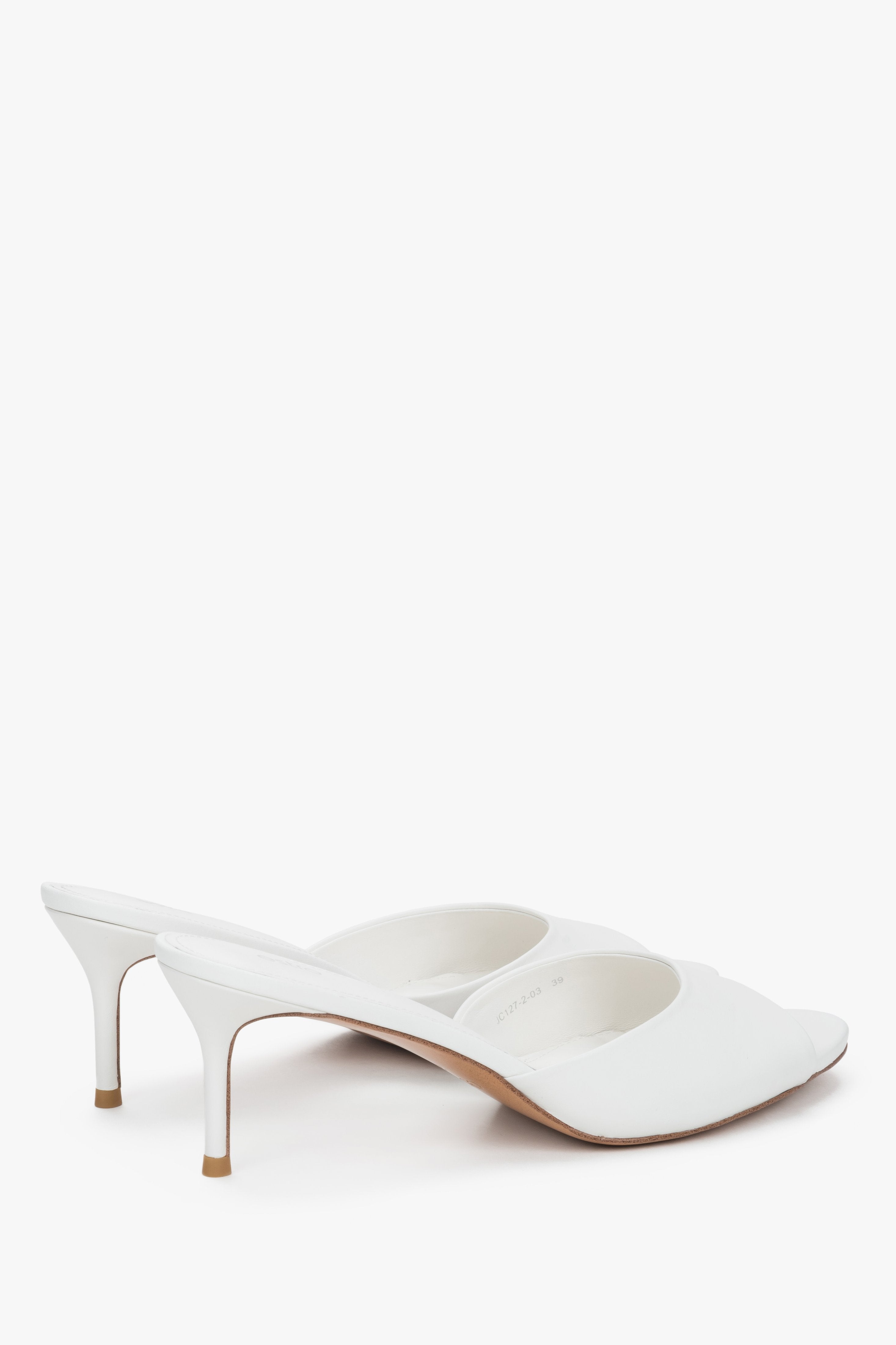 Back side view of women's white leather heeled mules with open heel