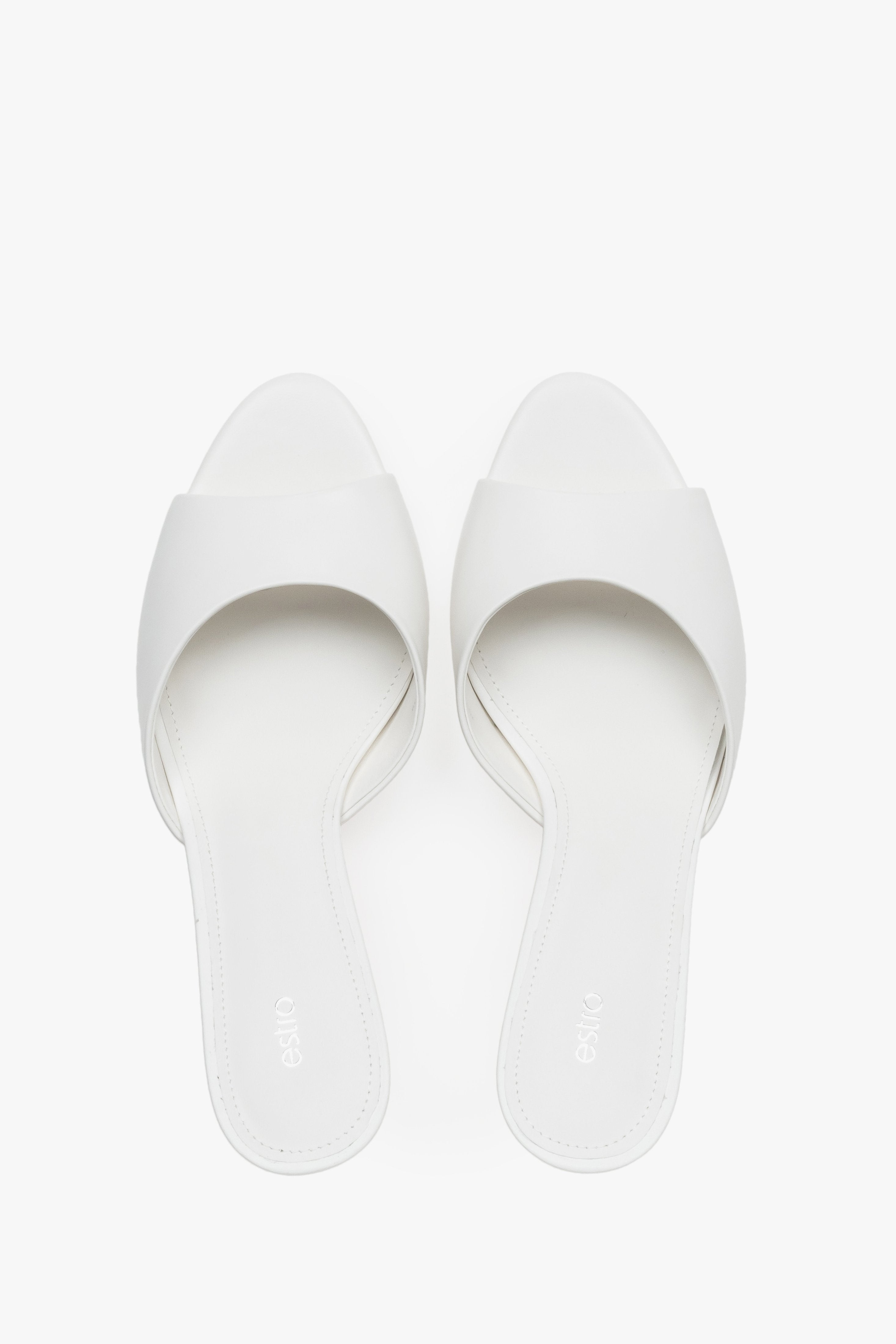Top view of women's white leather heeled mules by Estro