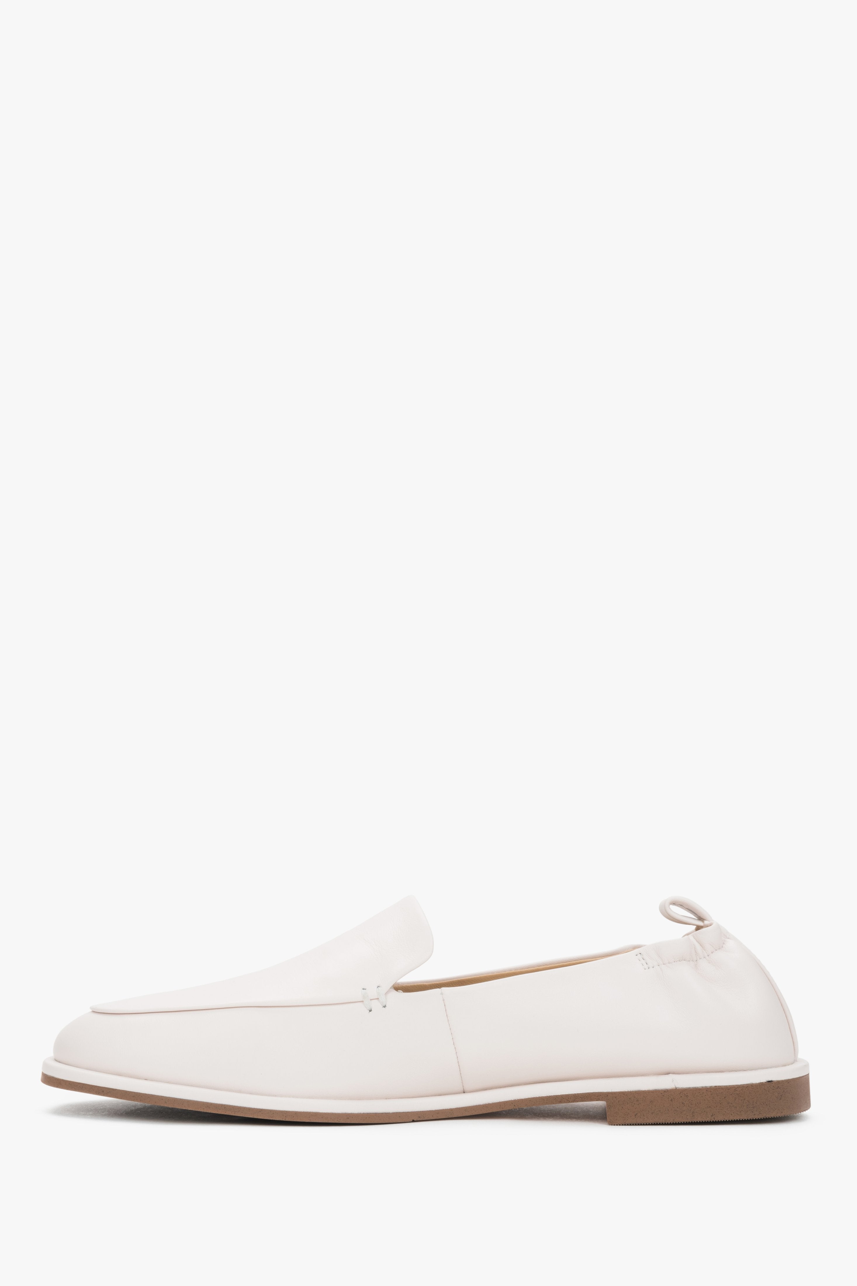Side view of women's white leather loafers by Estro