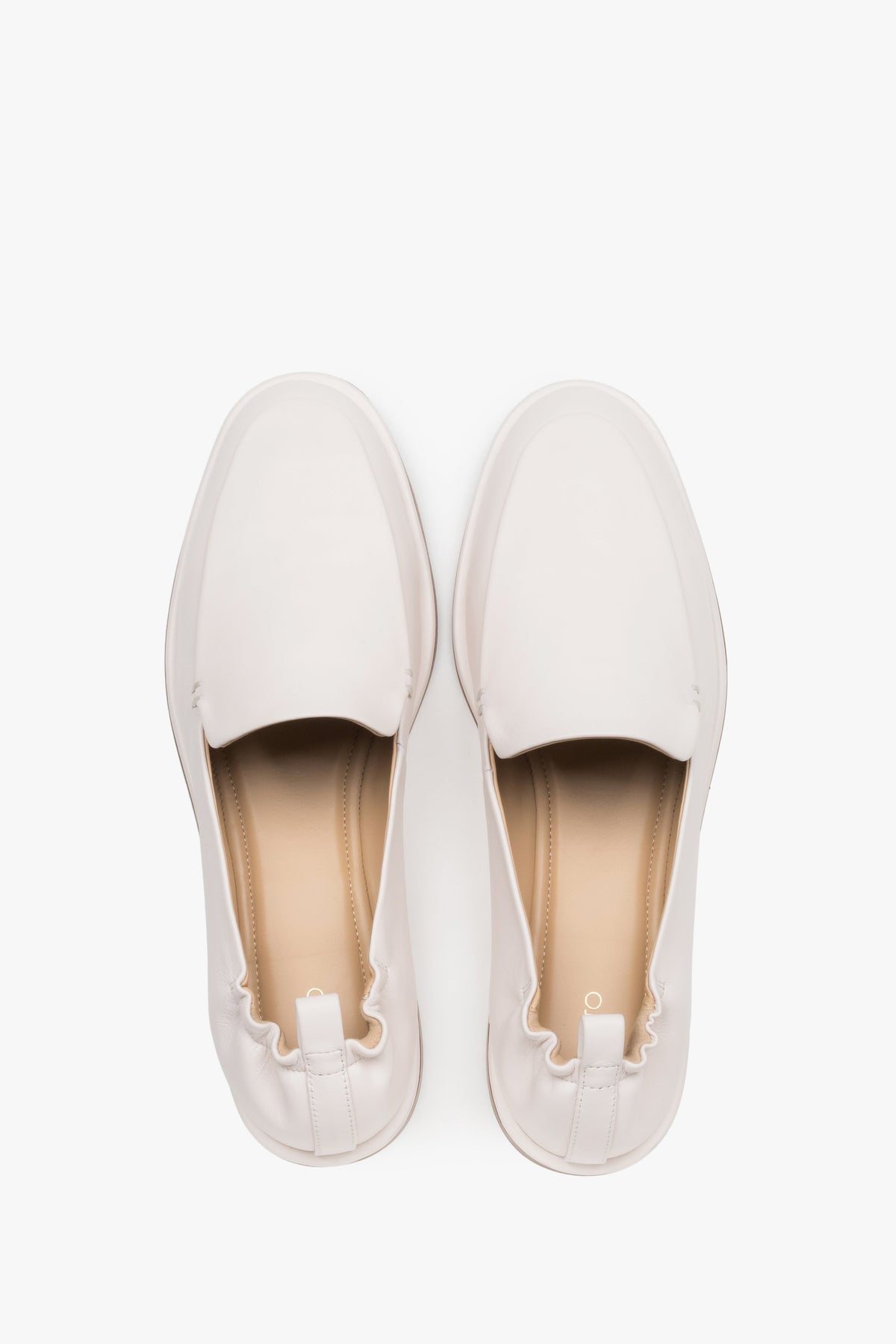Top view of women's white leather loafers by Estro