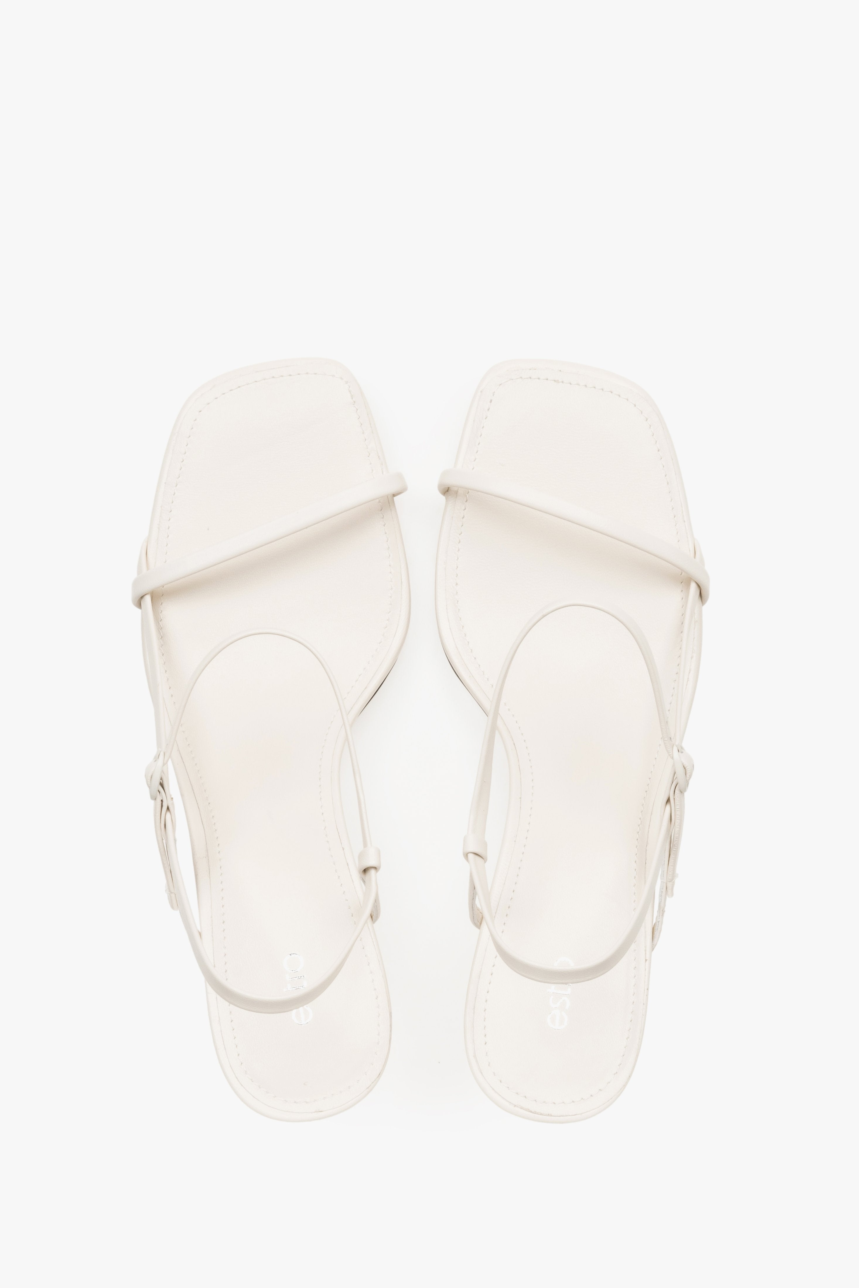 Women’s white low-heel sandals made from genuine leather, featuring thin straps by Estro – top view.