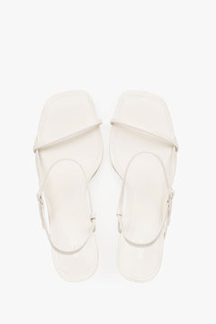 Women’s white low-heel sandals made from genuine leather, featuring thin straps by Estro – top view.