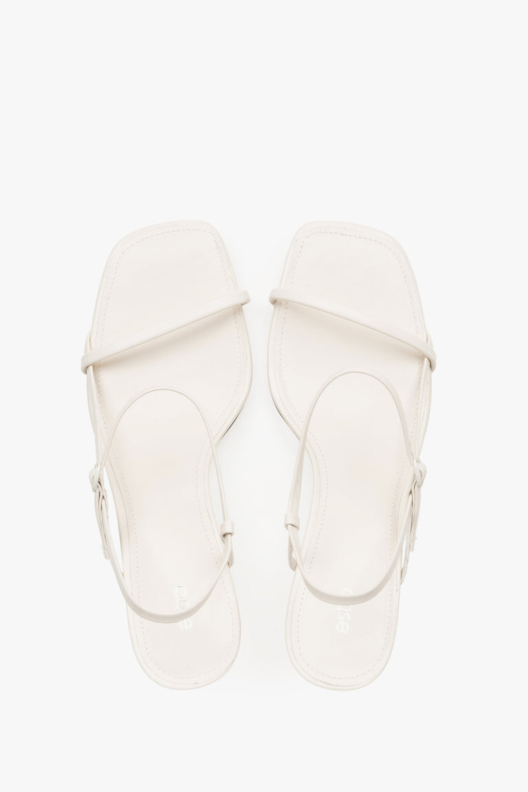 Women’s white low-heel sandals made from genuine leather, featuring thin straps by Estro – top view.