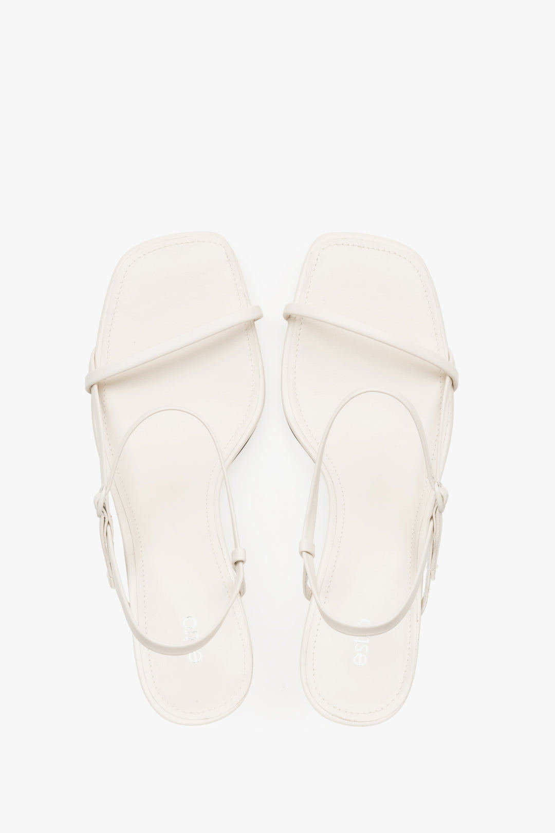 Women’s white low-heel sandals made from genuine leather, featuring thin straps by Estro – top view.