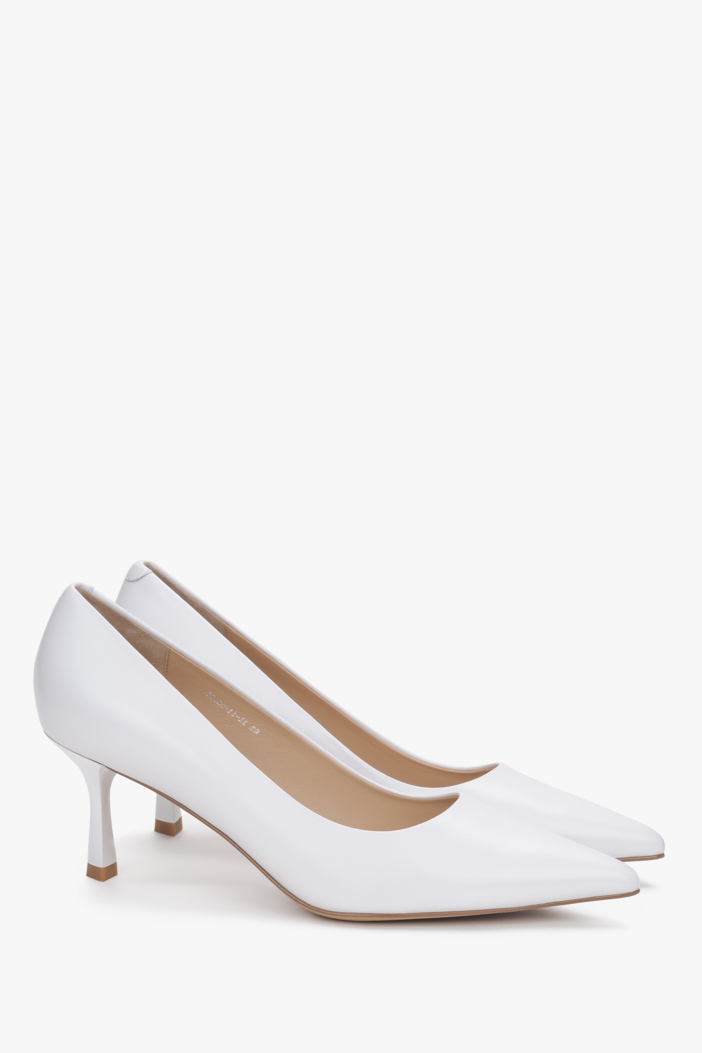White leather pointed-toe shoes with low heels.