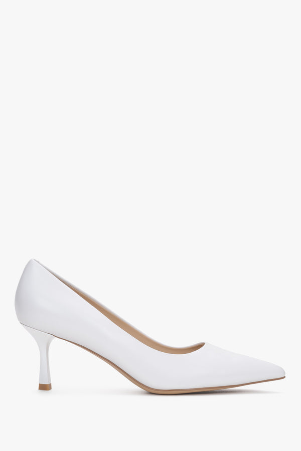 Side profile of white leather pointed-toe shoes.