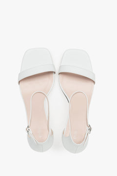 Sophisticated women's white sandals by Estro, crafted genuine leather, and finished with a modern funnel heel.