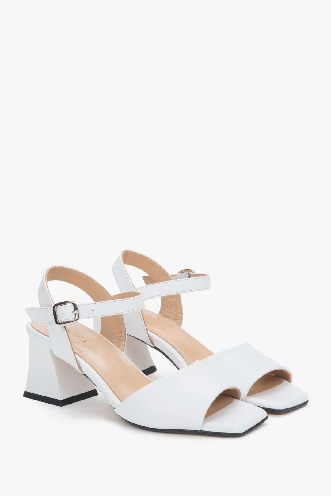 White leather block-heel sandals with an adjustable buckle.