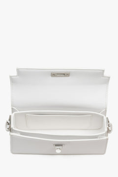 Interior view of women's white leather shoulder bag by Estro