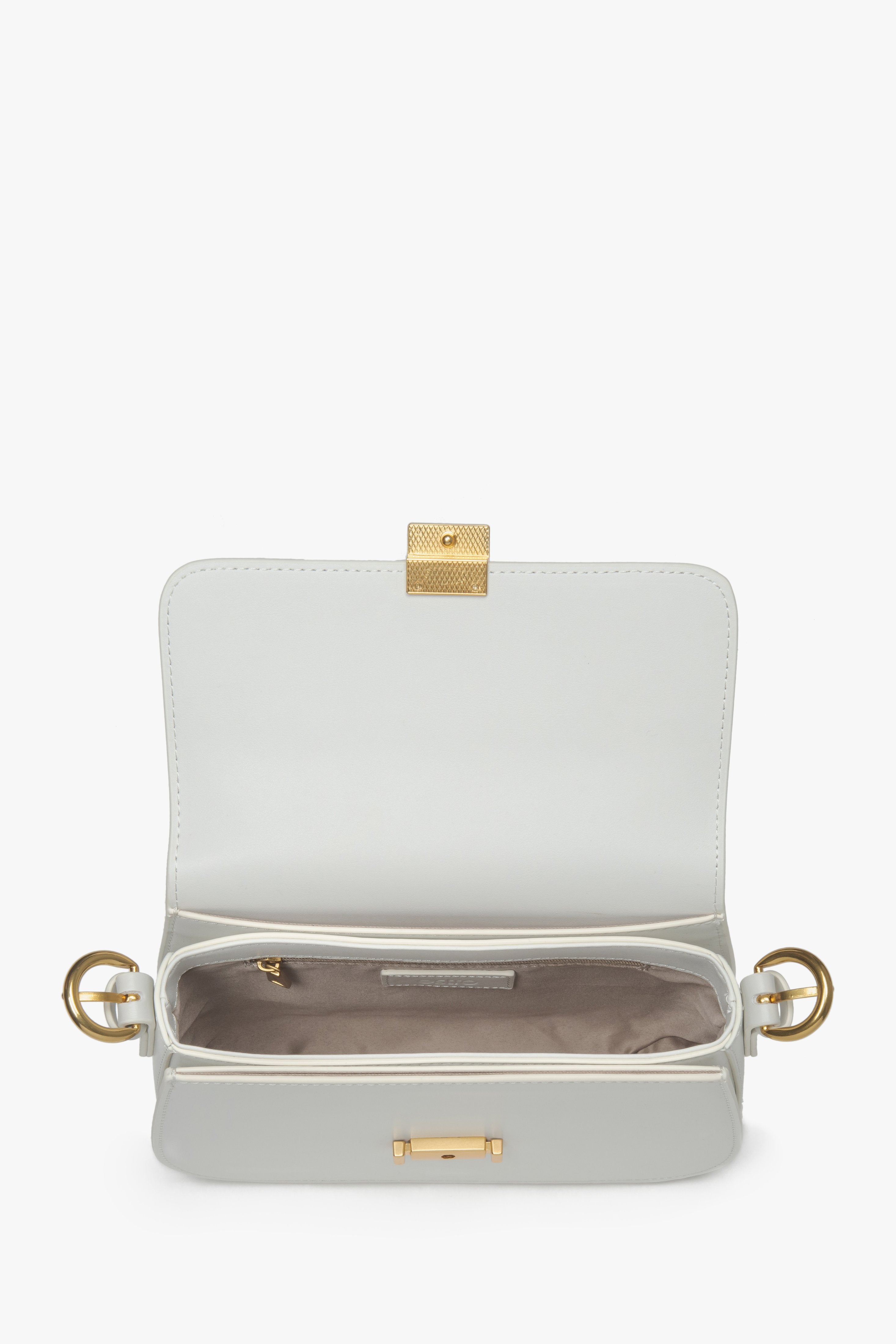 White leather women’s shoulder bag with gold-tone hardware – interior view.