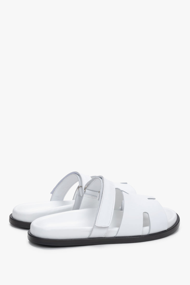 Women’s white leather slides with an adjustable strap by Estro – heel view.