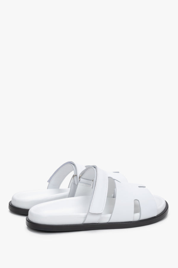 Women’s white leather slides with an adjustable strap by Estro – heel view.