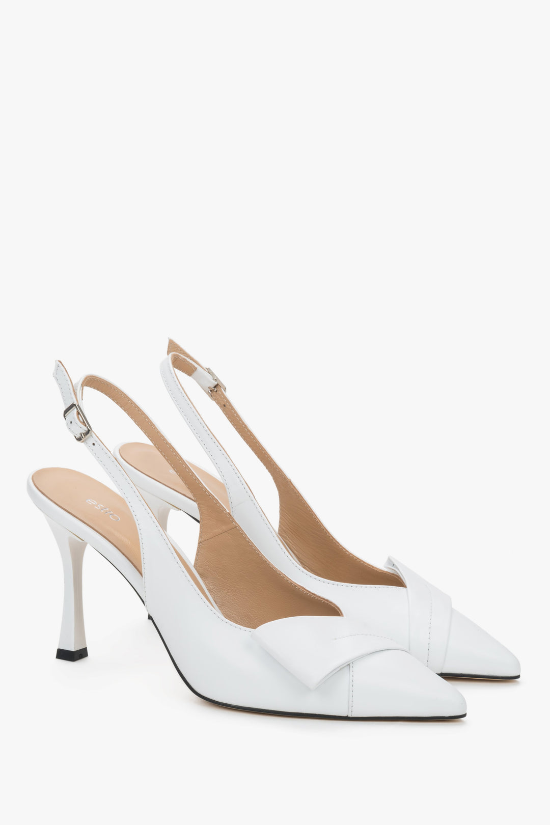White leather Estro slingback pumps with a high stiletto heel, featuring a deeply cut vamp, a geometric toe detail, and a slender strap around the heel.