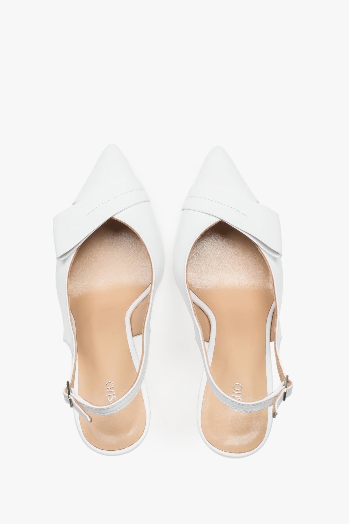 Top view of the pair of white pumps, showcasing the pointed toe, an applied leather buckle detail, and a light-colored insole featuring the brand logo.
