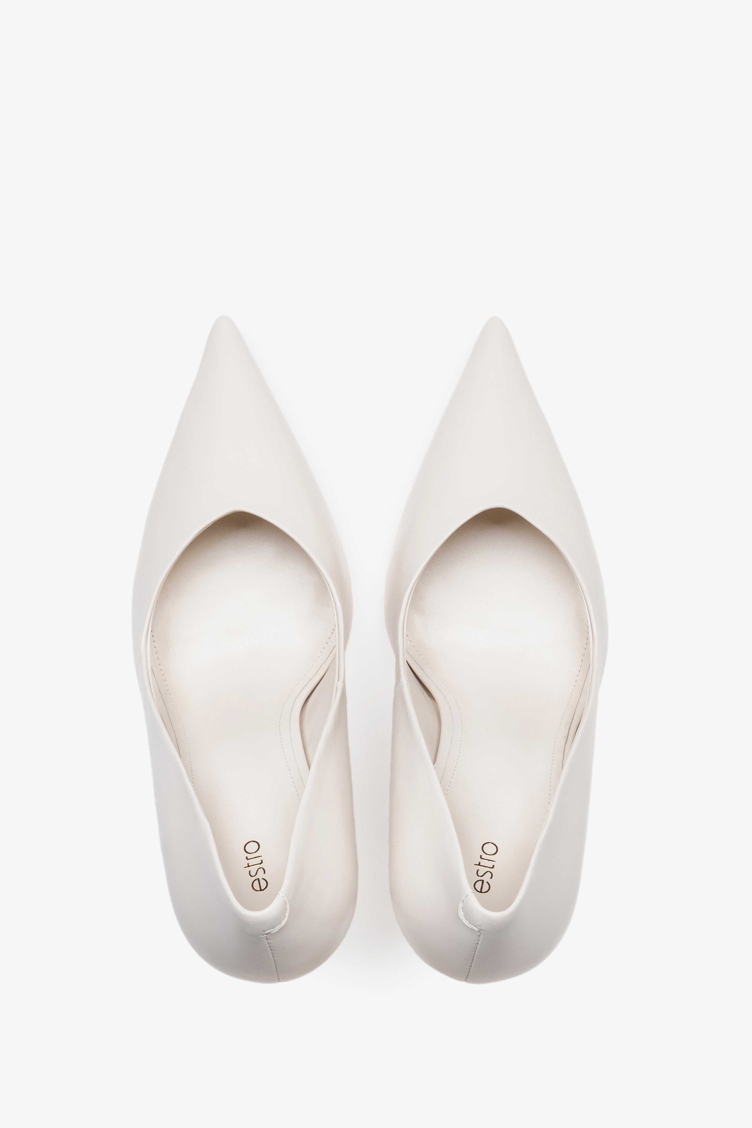 White leather women's stiletto pumps by Estro, featuring a slim high heel and a pointed toe.