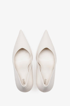 White leather women's stiletto pumps by Estro, featuring a slim high heel and a pointed toe.