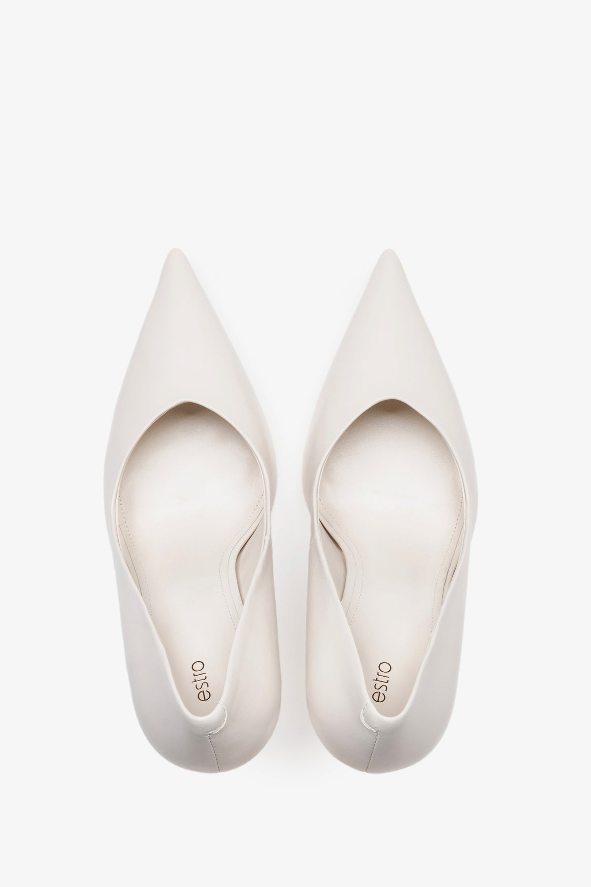 White leather women's stiletto pumps by Estro, featuring a slim high heel and a pointed toe.