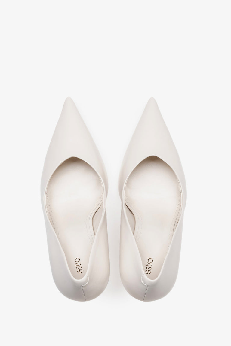 White leather women's stiletto pumps by Estro, featuring a slim high heel and a pointed toe.