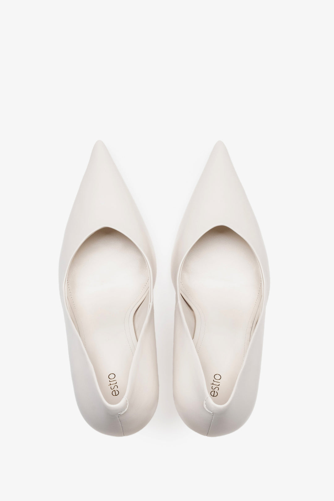 White leather women's stiletto pumps by Estro, featuring a slim high heel and a pointed toe.