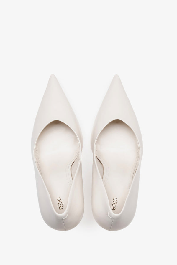 White leather women's stiletto pumps by Estro, featuring a slim high heel and a pointed toe.