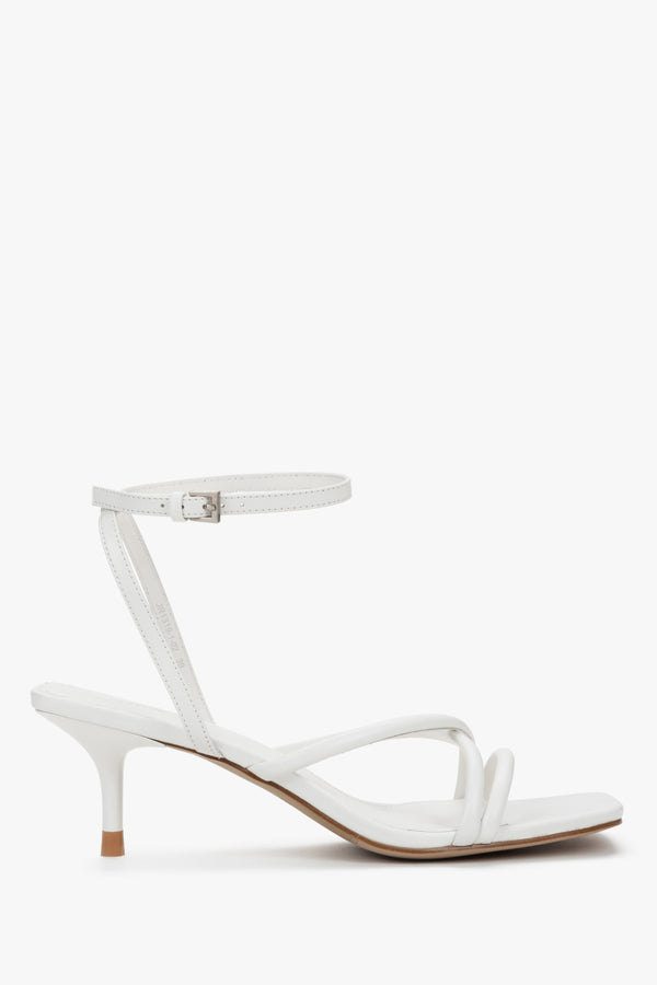 Women's white leather stiletto sandals by Estro with thin straps.
