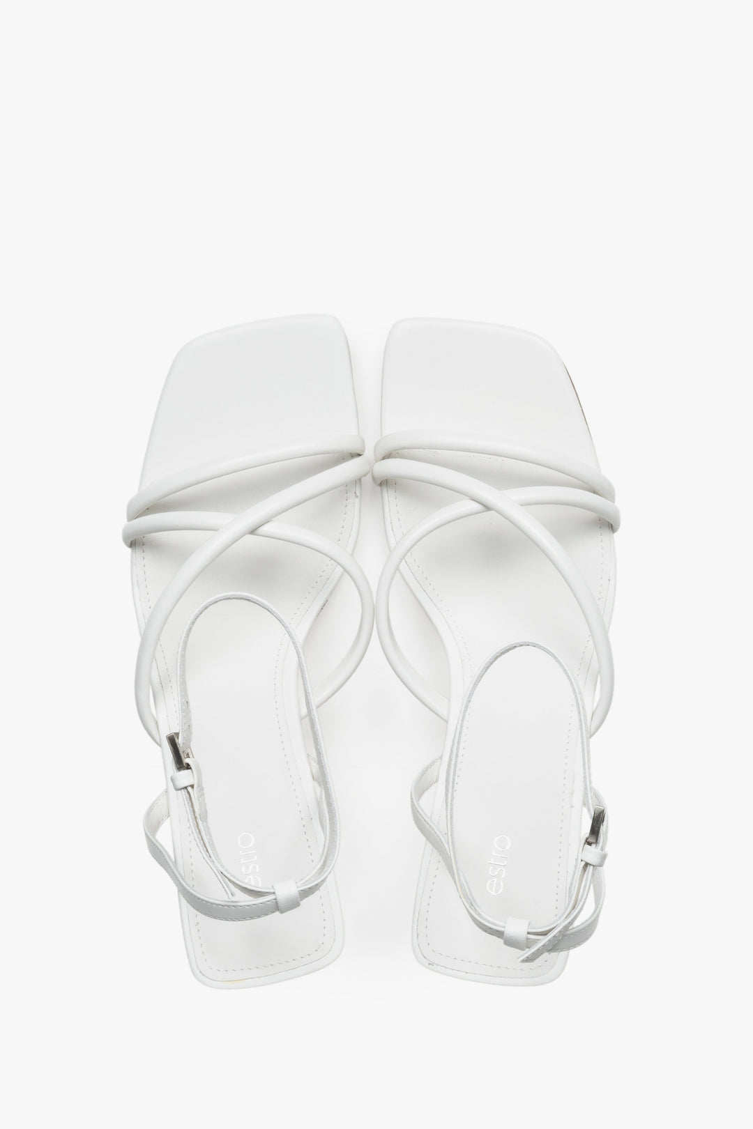 Top view of women's white leather stiletto sandals by Estro.