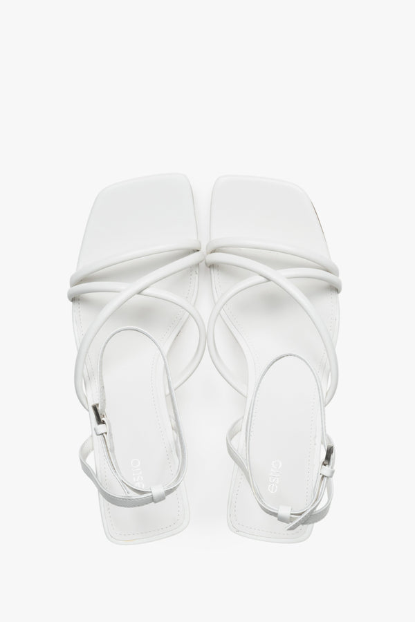 Top view of women's white leather stiletto sandals by Estro.
