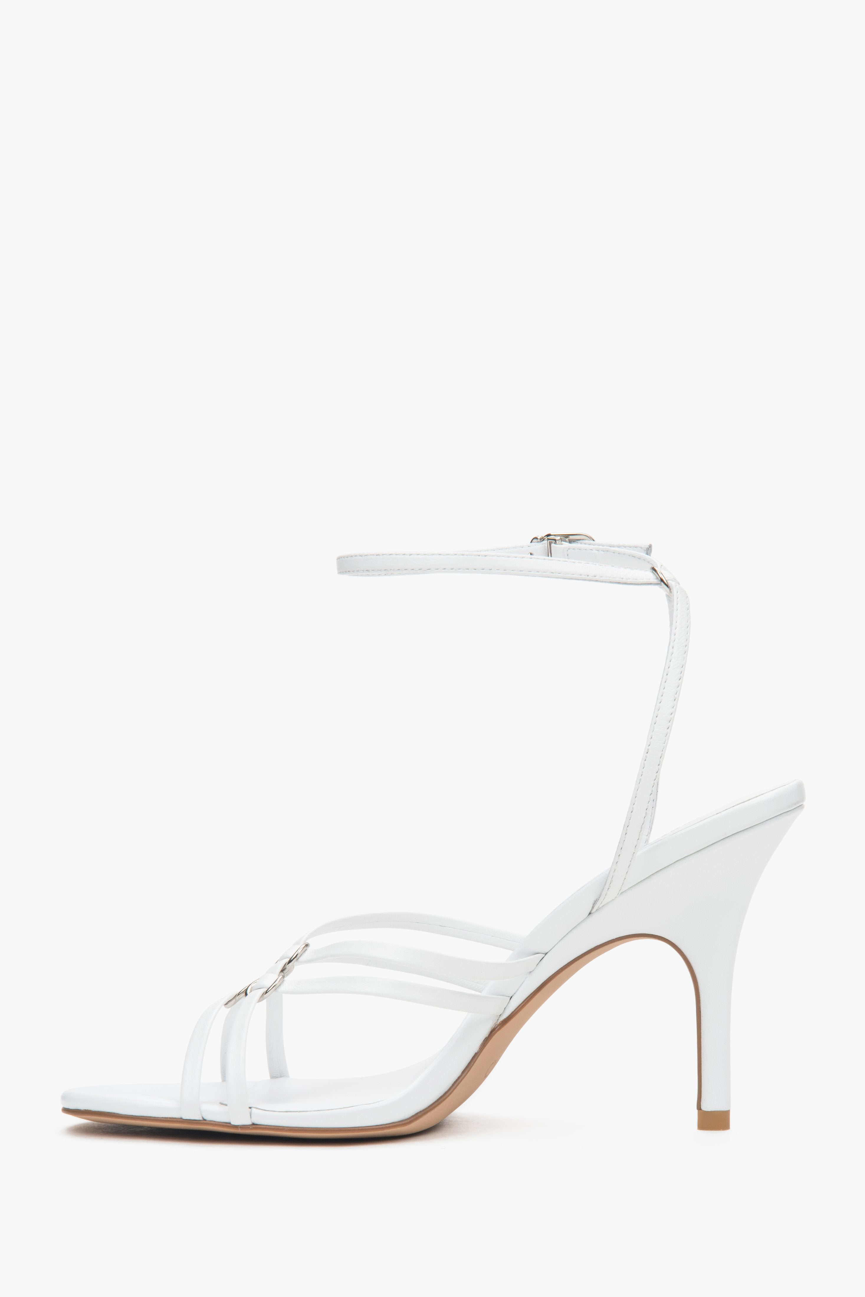 Women’s white leather stiletto sandals with silver details by Estro.