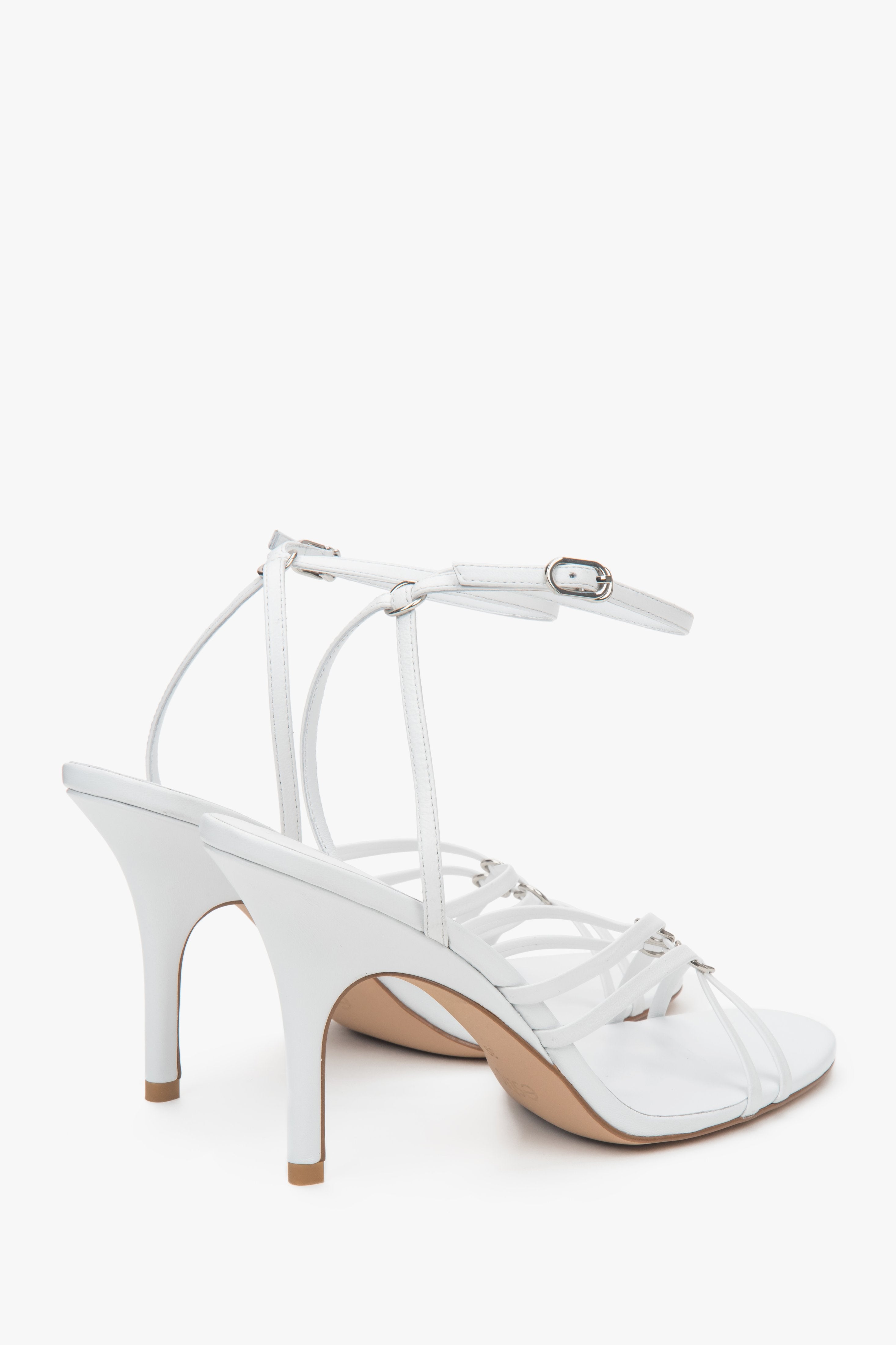 Women’s white leather stiletto sandals with silver details by Estro.