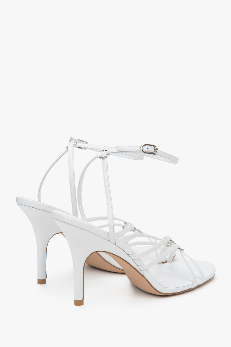 Women’s white leather stiletto sandals with silver details by Estro.