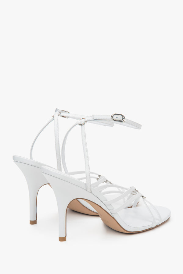 Women’s white leather stiletto sandals with silver details by Estro.