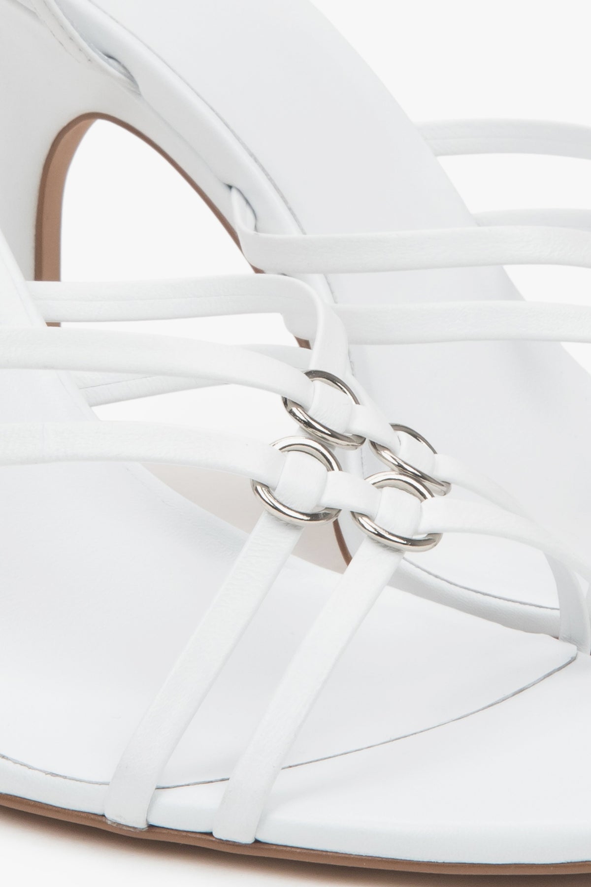 Women’s white leather stiletto sandals with silver details by Estro.
