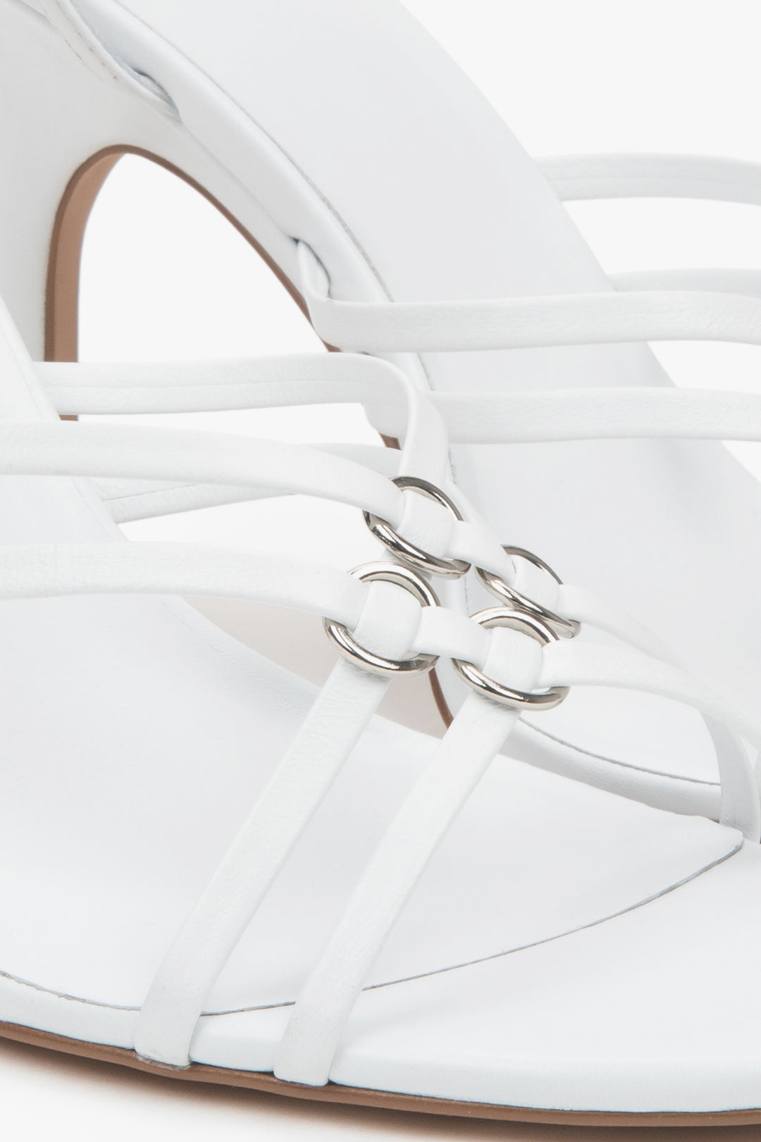 Women’s white leather stiletto sandals with silver details by Estro.
