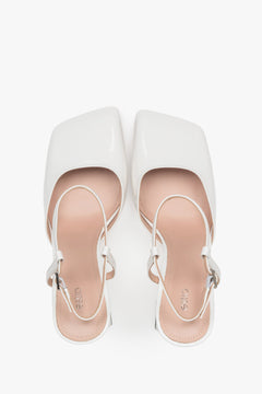 Women’s white block heel sandals in patent leather by Estro – top view.