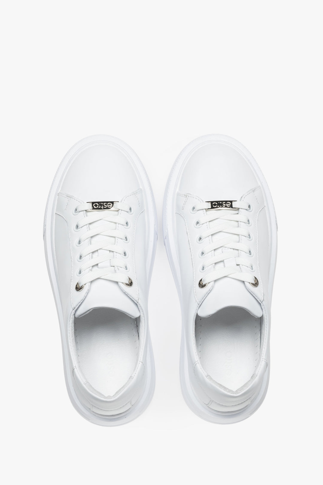 A classic lace-up design with decorative brand logo details on the laces highlights the elegant and recognizable Estro style.