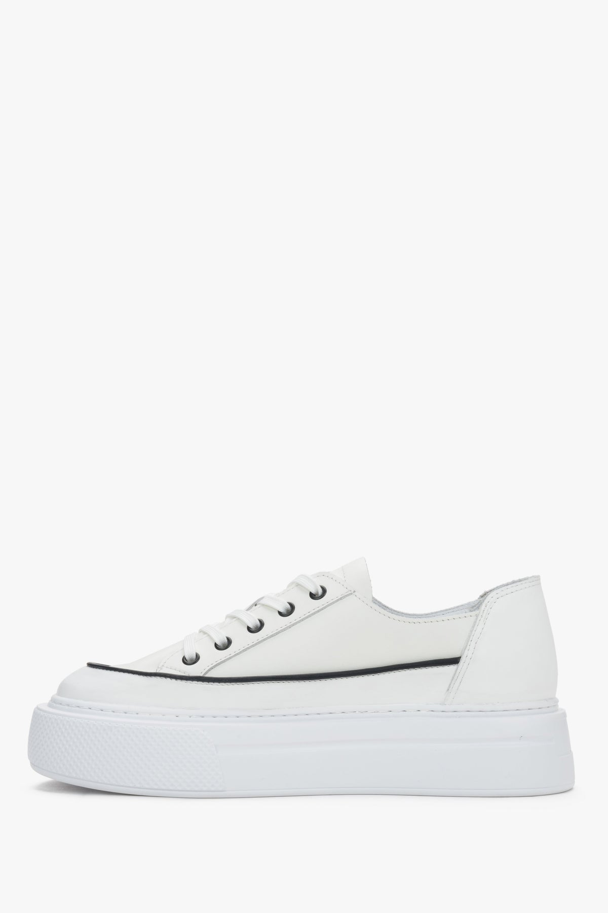 Side view of women’s white leather platform sneakers with lace-up fastening.