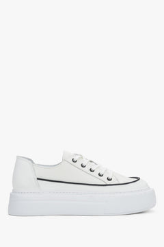 Side view of women's white leather platform sneakers with lace-up closure.