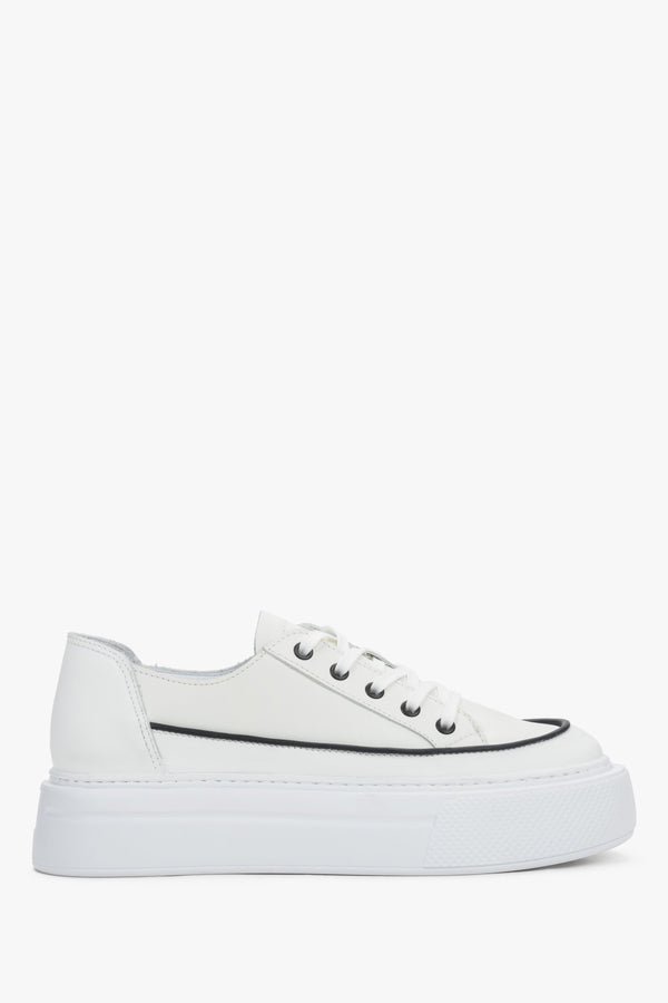 Side view of women's white leather platform sneakers with lace-up closure.