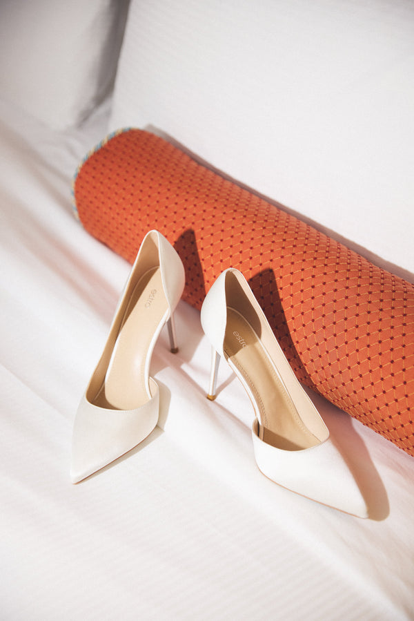 White women’s stiletto heels by Estro.