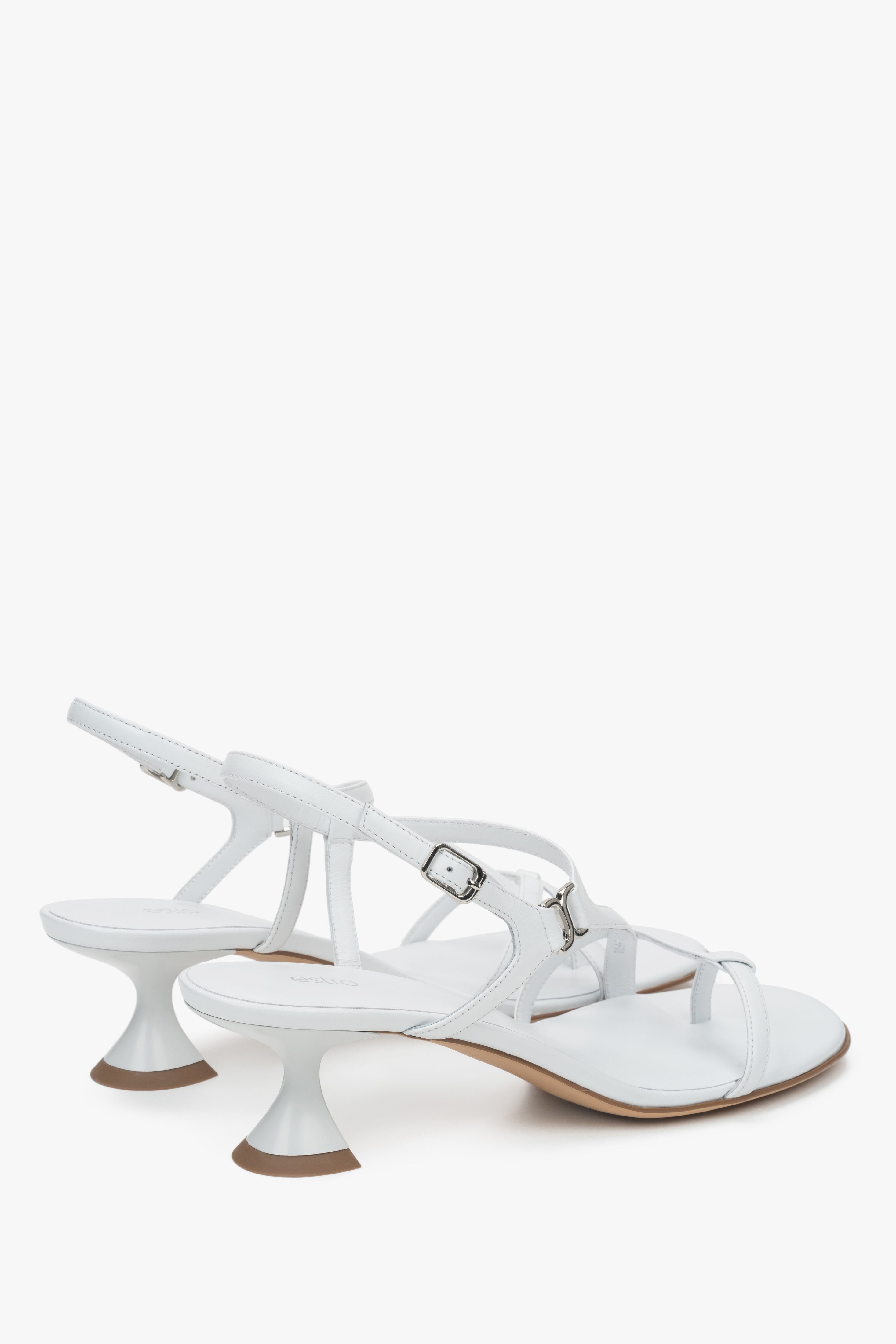 Made of woven straps, white women’s sandals with a funnel heel Estro.