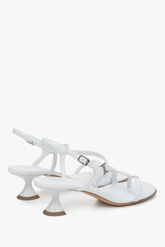 Made of woven straps, white women’s sandals with a funnel heel Estro.