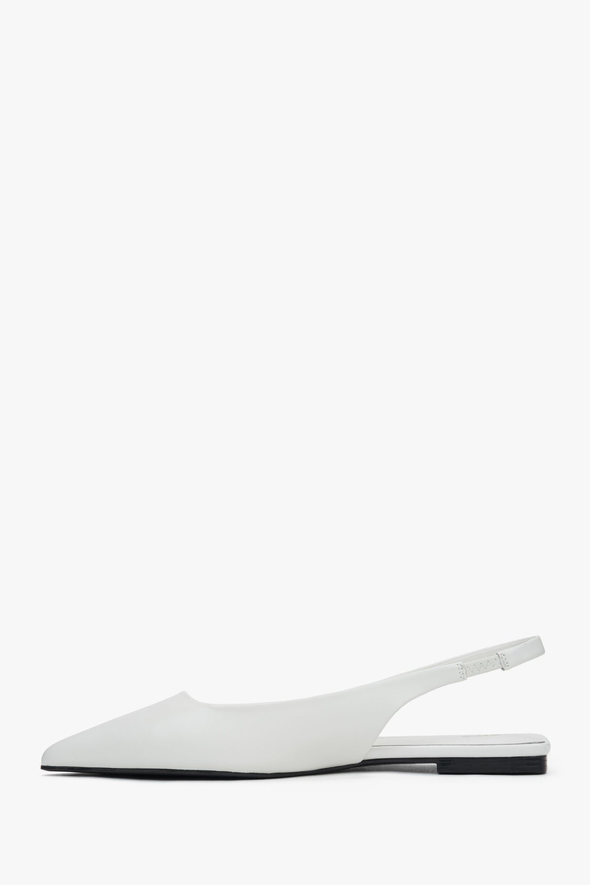 White flat slingback sandals with a pointed toe.