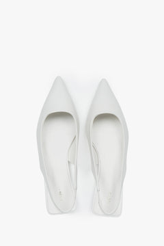 Elegant women's white slingback sandals with a pointed toe and flat heel.