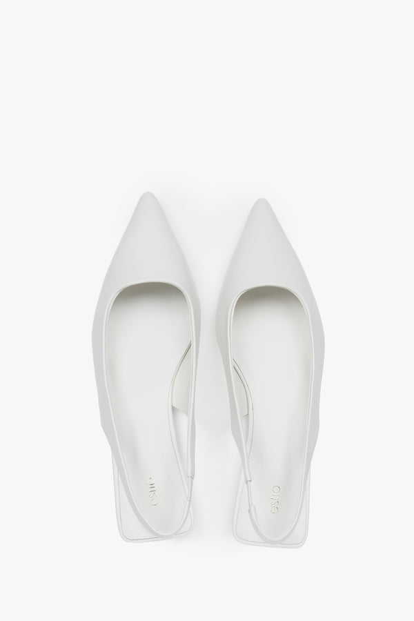 Elegant women's white slingback sandals with a pointed toe and flat heel.