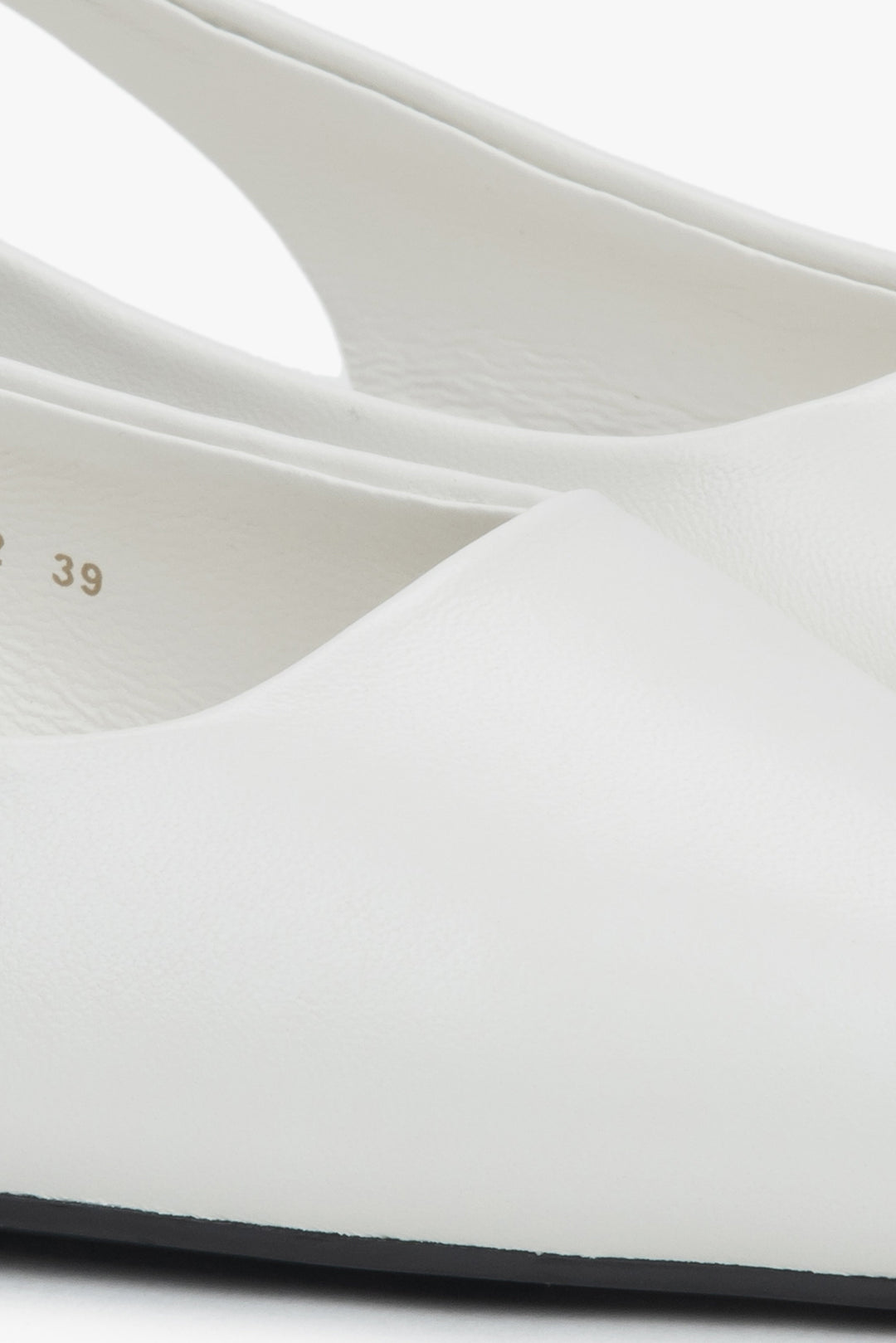 Stylish women's slingback sandals with white detailing and a pointed toe.